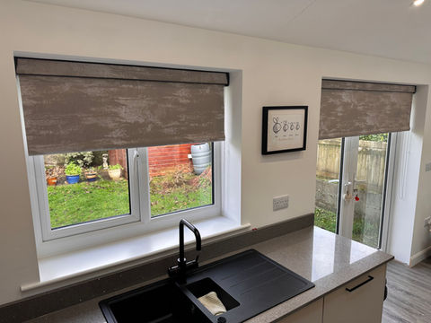 Roller blinds on a kitchen window and French door