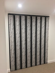 Black and grey striped vertical blinds