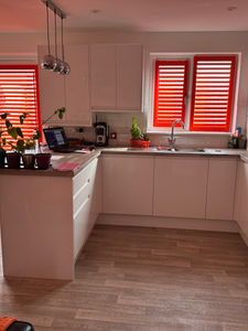 Red perfect fit shutters in a kitchen