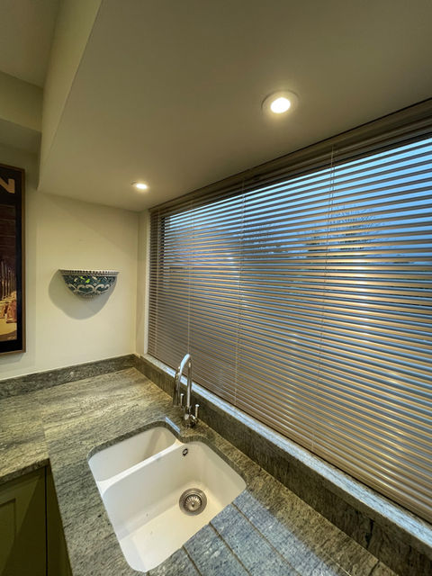 Kitchen window with a Venetian blind