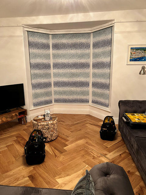Striped blinds in a bay window