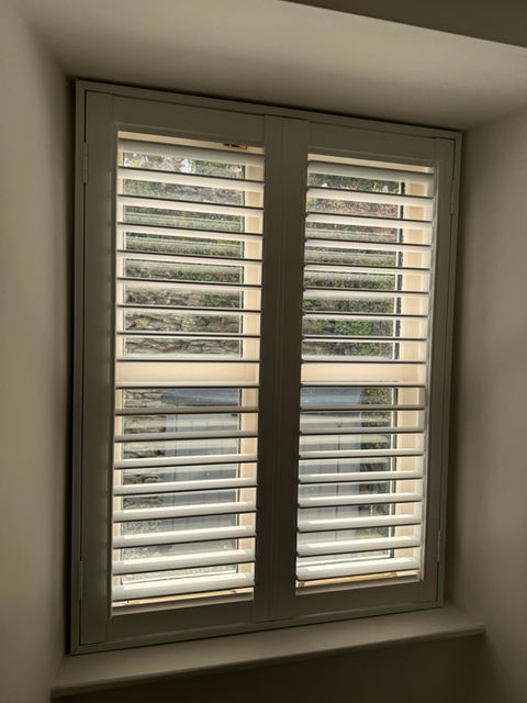 Small window with closed shutters