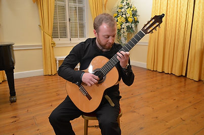 Adam (a WiGS member) playing the guitar