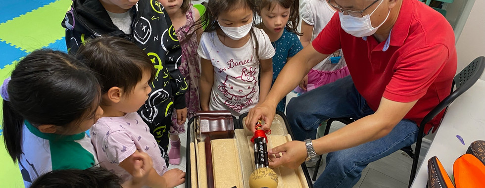Summer Campers learning about Chinese music