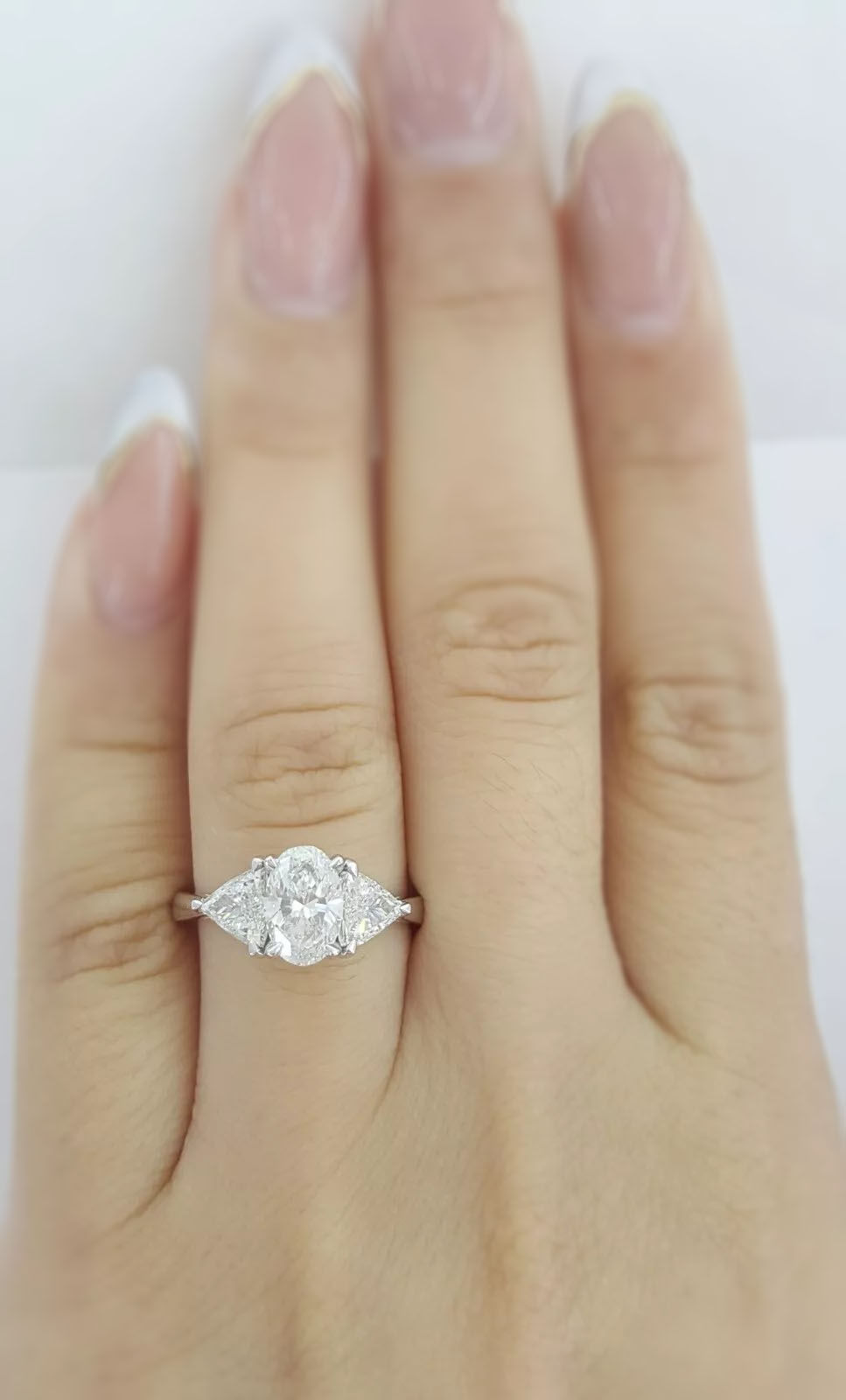 Thumbnail: Platinum 1.80ctw Oval Diamond and Trillion Cut Platinum 1.80ctw Oval Diamond and Trillion Cut 3 Stone 3 Stone Engagement Ring