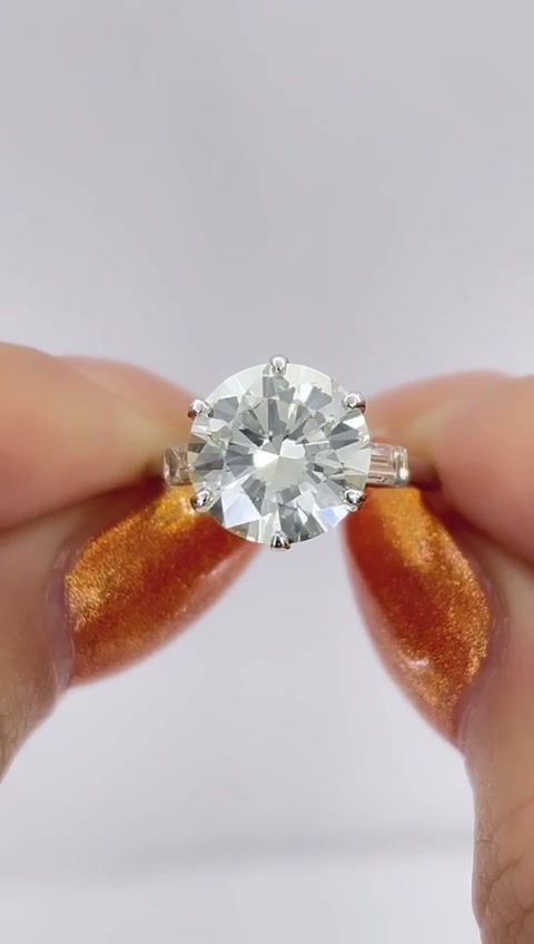 Thumbnail: Vintage Platinum 3.80ctw Round Brilliant and Baguette Cut Diamond 3 Stone Ring