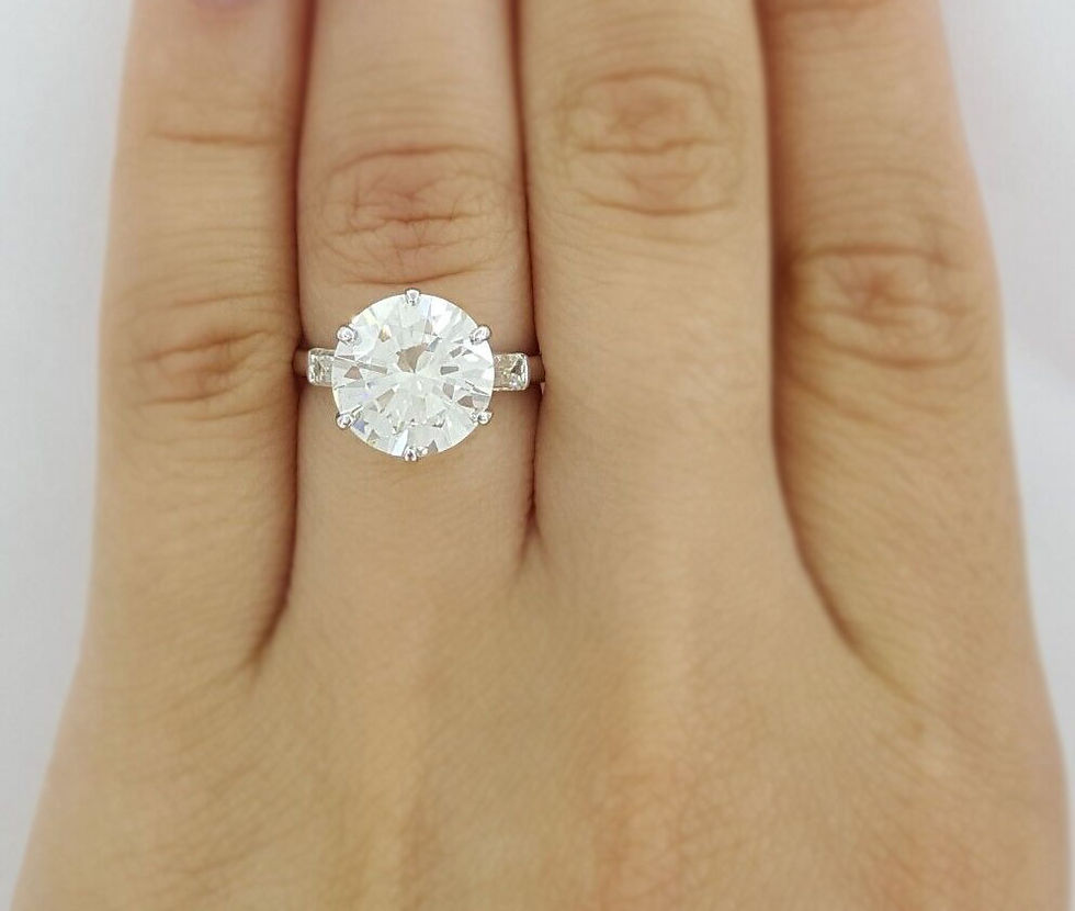 Thumbnail: Vintage Platinum 3.80ctw Round Brilliant and Baguette Cut Diamond 3 Stone Ring