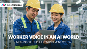 Factory workers using a digital tablet on the production floor, representing worker voice and AI-enabled supplier engagement.