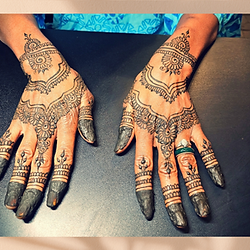 multiple hands with henna