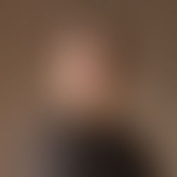 Business professional photographed with natural posture and genuine expression