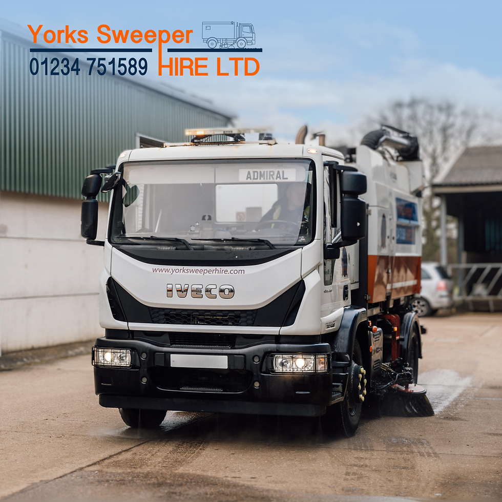 Street sweeper truck labeled "Admiral" in a warehouse area. Visible text: "Yorks Sweeper Hire LTD," "IVECO," and contact number.