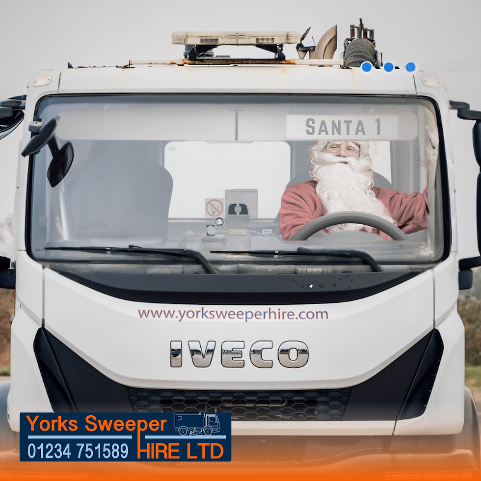 Santa driving a Road Sweeper white Iveco truck labeled "SANTA 1." Visible Yorks Sweeper Hire LTD logo and contact. Overcast sky in the background.