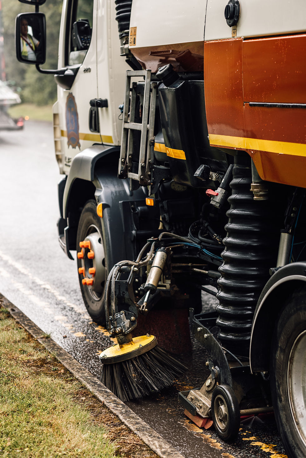 Road Sweeper using its side brush to clean a public road. Yorks Sweeper Hire