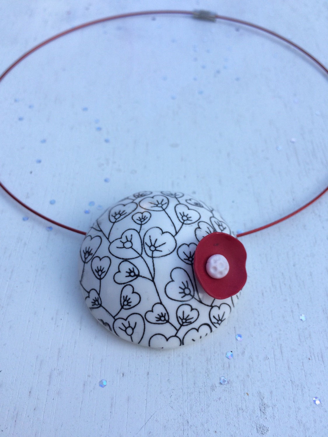 Pendentif rond fleur 