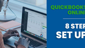 man using laptop with quickbooks online set up