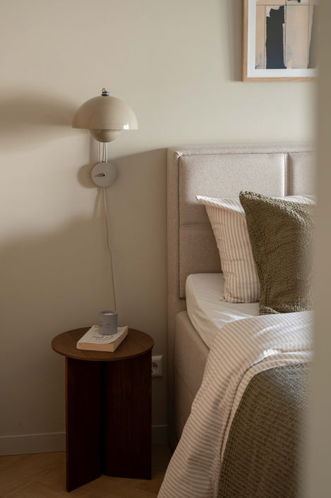 Scandinavian bedroom with a neutral and warm style