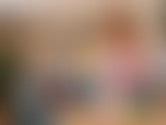 A person using a damp microfiber cloth to reduce dust on a wooden table in a Toronto home