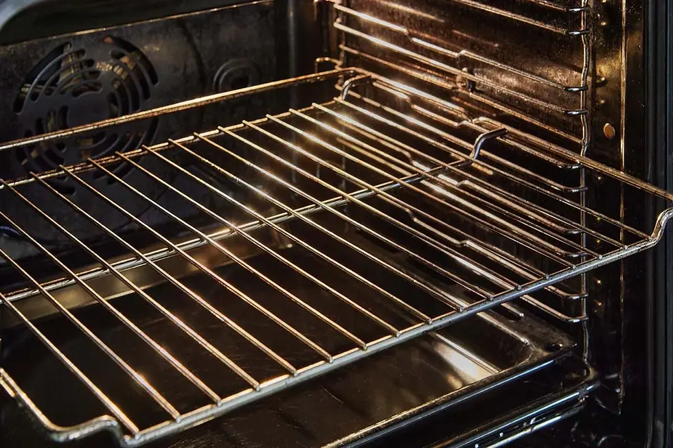 An image showing the inside of an oven, featuring a clean metal oven rack