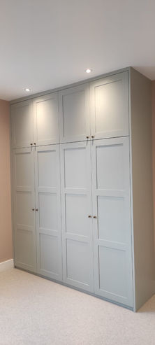 Custom fitted light grey wardrobe