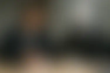 A person and a robot sitting together