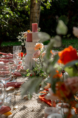 orange and blush flowers table styling