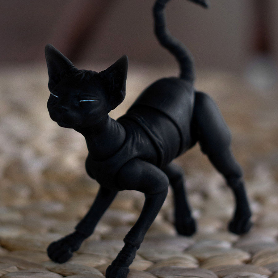 Thumbnail: Poseable black Sphynx resin cat showing a realistic stalking posture and smooth ball joints.
