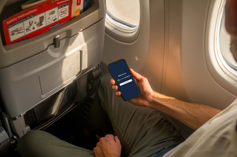 Free iPhone 14 Pro on a Plane Mockup (Mockuuups Studio)