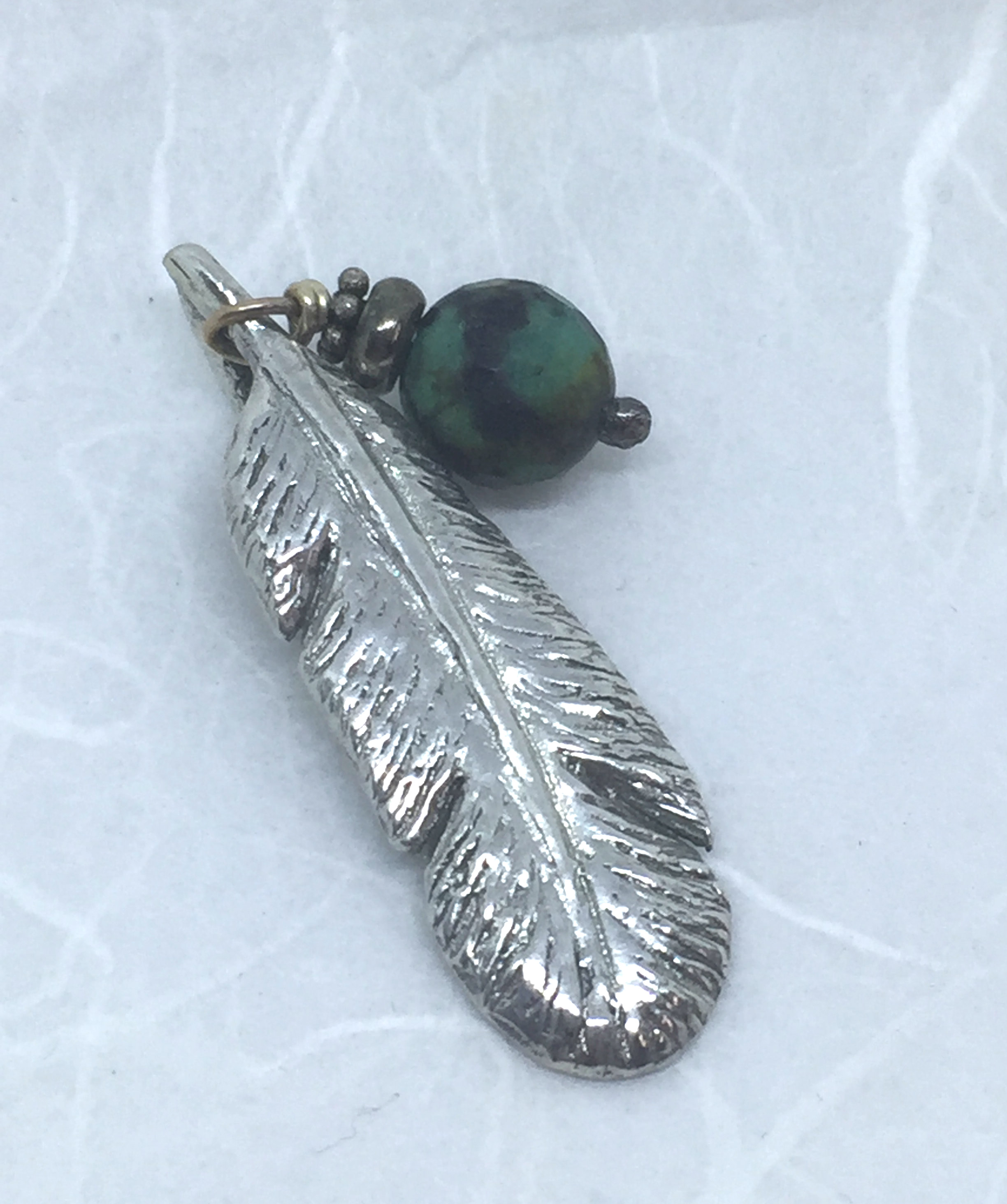 feather and tuquoise pendant