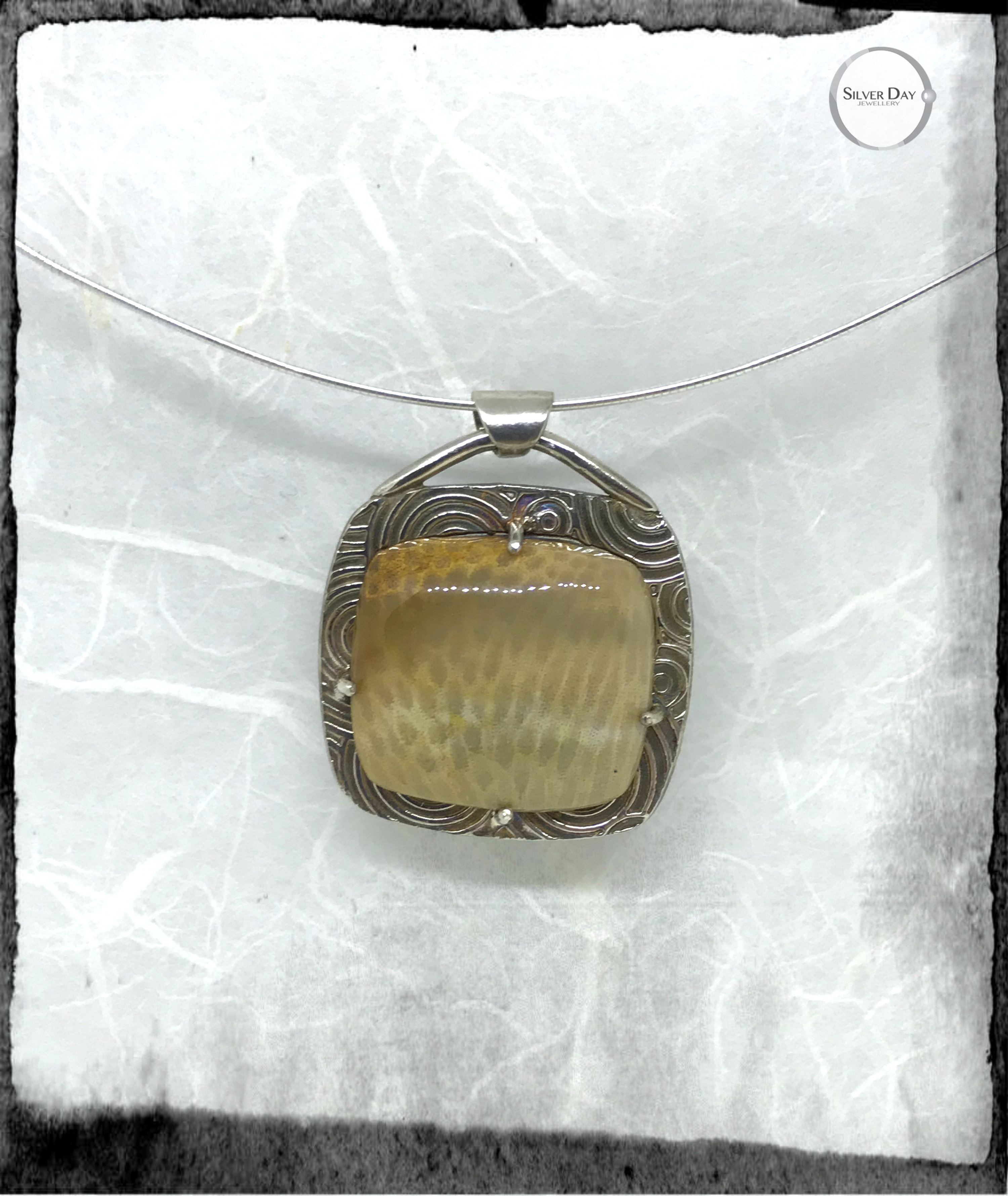 Coral and sterling silver pendant