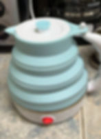 Teal Silicone Travel Kettle that collapses flat for portablitiy