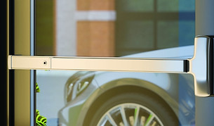 silver push bar door handle on glass door