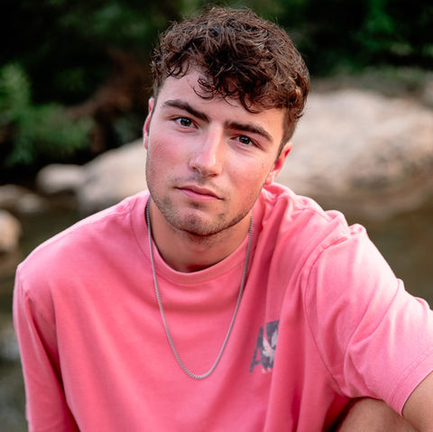 senior boy poses for photos in Joplin MO