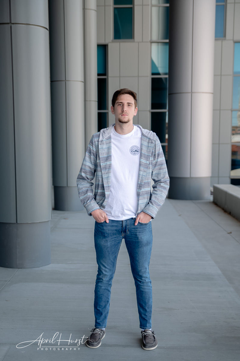 Noah stands in downtown Joplin for his senior photos