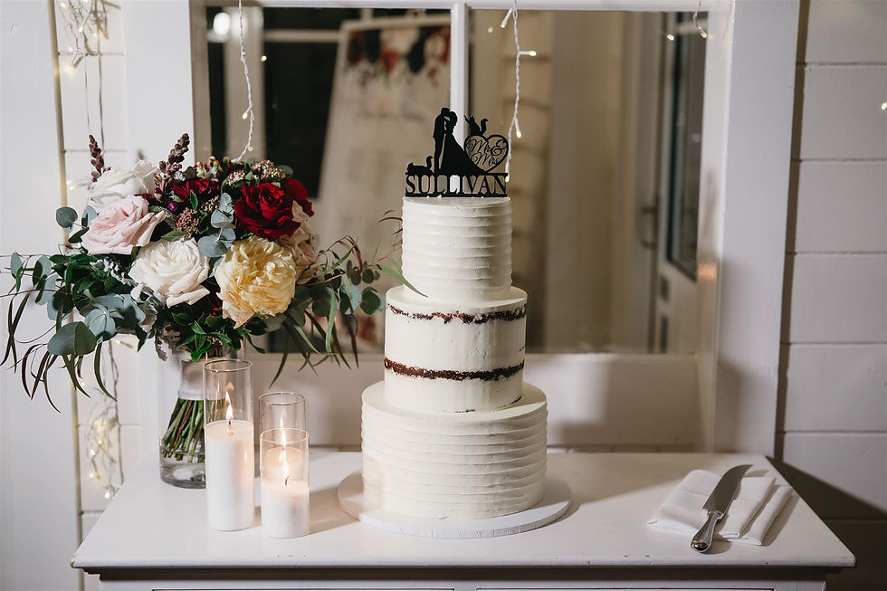 Three-tiered semi-naked wedding cake at Weddings at Tiffany's in Maleny, Queensland