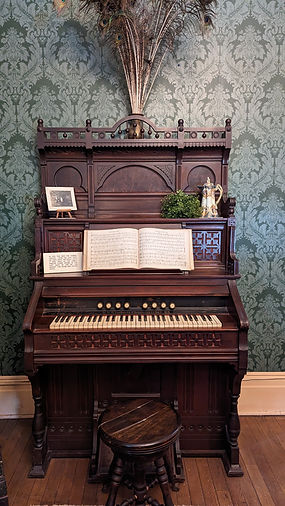 Picture of the Kimball pump organ in the Parlor