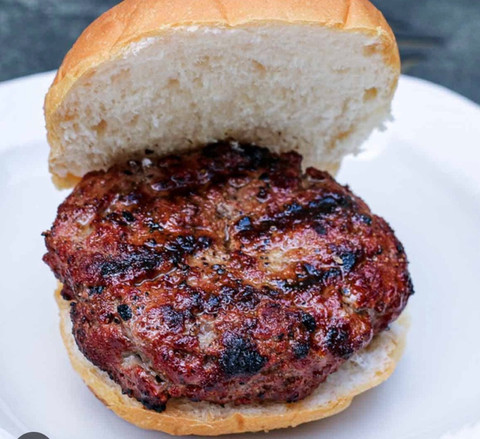 Grilled burger patty on a bun