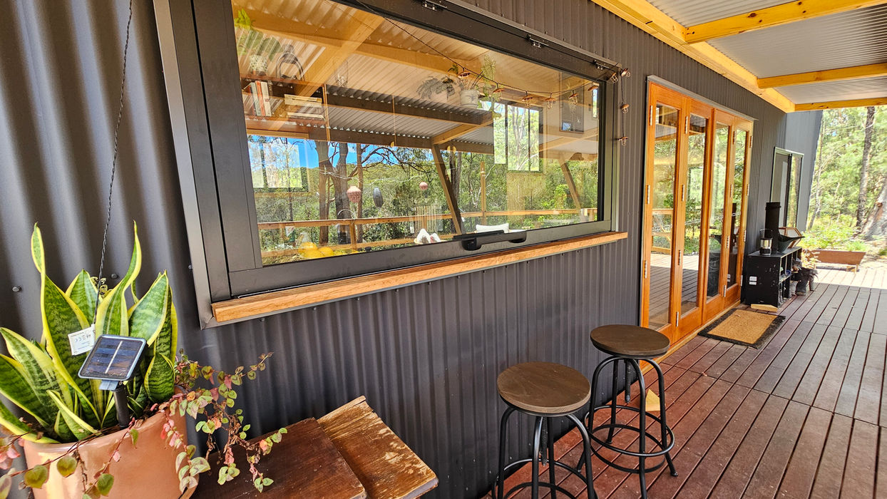 Portable tiny house designed for minimalist and eco-conscious living with deck oulook