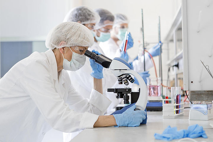 scientists-studying-a-virus-looking-through-microscope-nastasic.jpg