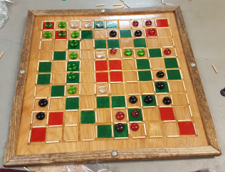 A latter wooden version of Squarin' Off with glass beads and painter