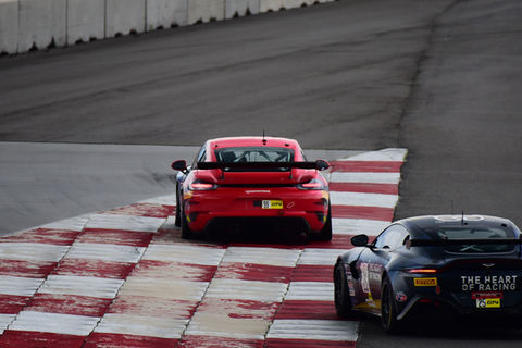 Porsche and Aston Martin on the rumble strips