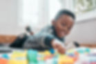 come-play-with-me-shot-adorable-little-boy-playing-with-building-blocks-home.jpg