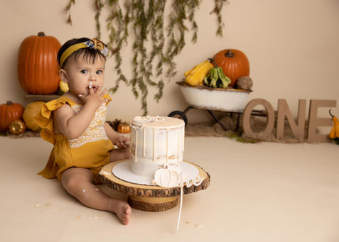 Baby girl's first birthday cake smash, autumn theme