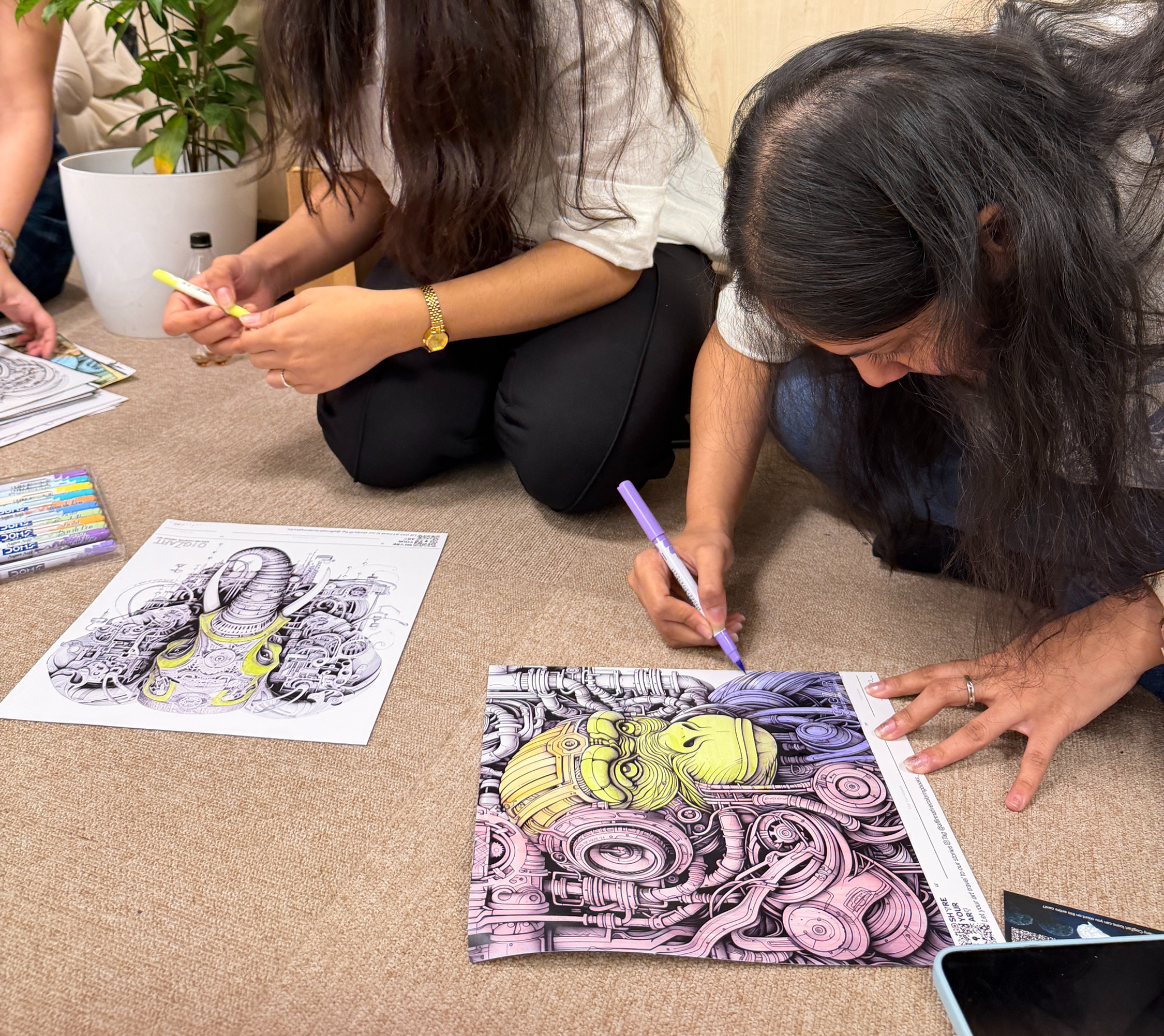The image shows people engaged in a creative practice, coloring detailed artwork from the Unleash Your Inner Animal book series by ACBs.