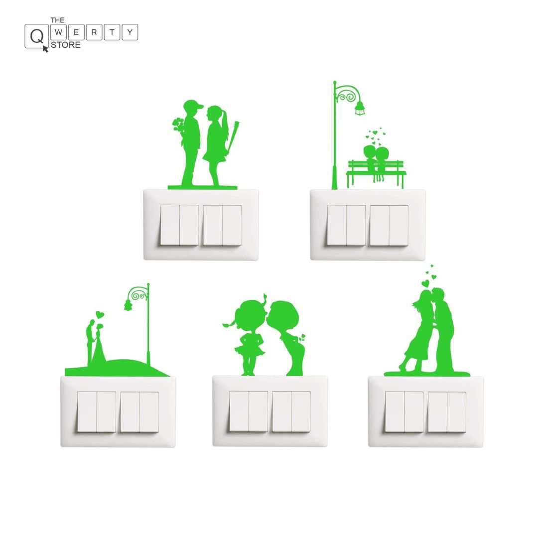 Green wall stickers on light switches, couples kissing and holding hands.