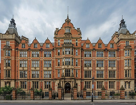 London School of Economics building with red brick architecture and cloudy sky.