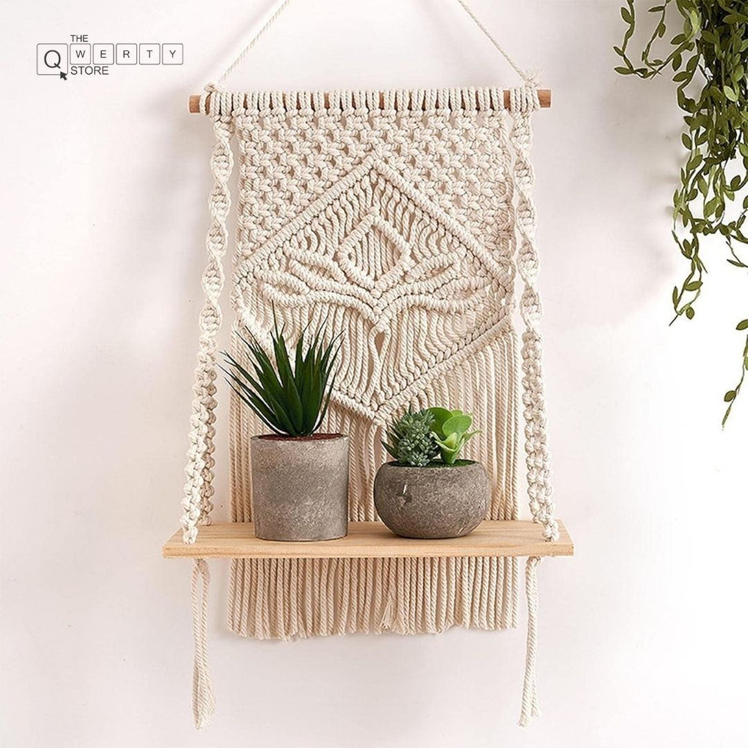Macrame wall hanging shelf with plants, The Qwerty Store, and decorative knots.