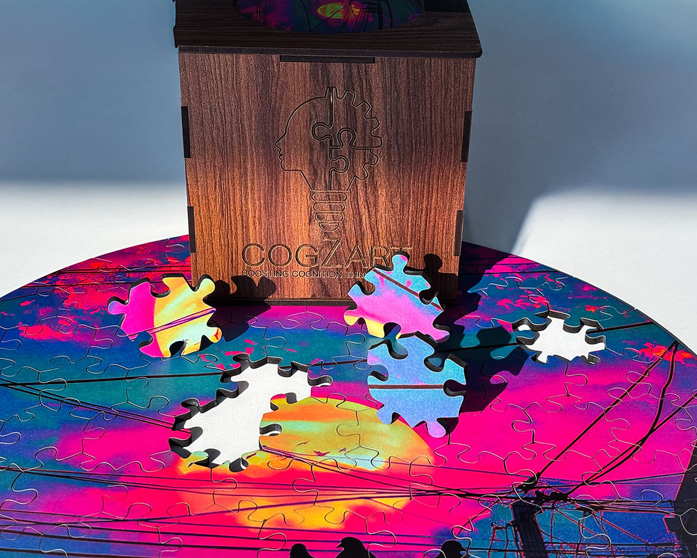 Circular puzzle with colorful abstract artwork, loose pieces, and CogZart wooden box, showcasing vibrant design and interlocking shapes