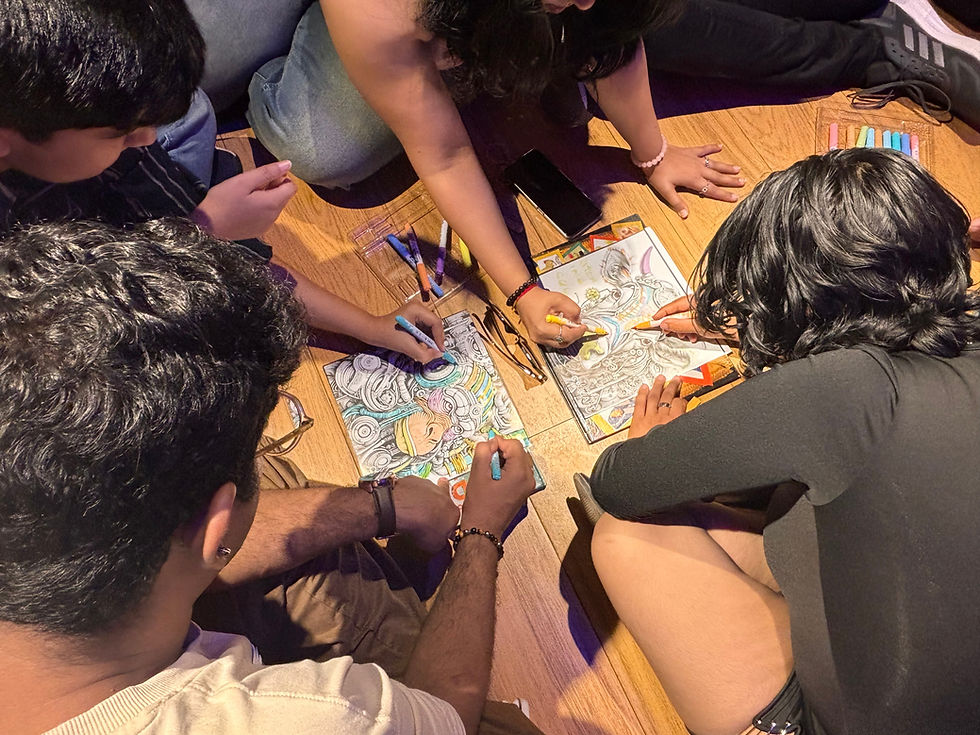 Adults enjoying a CogBox creative coloring activity together as a screen-free way to cure boredom.