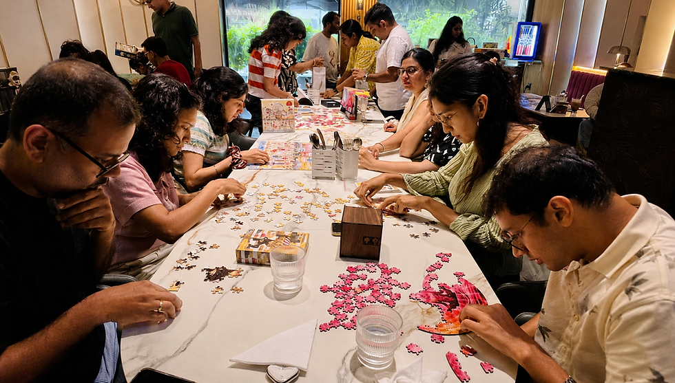 Adults solving a CircZles puzzle together during a social puzzle-solving activity
