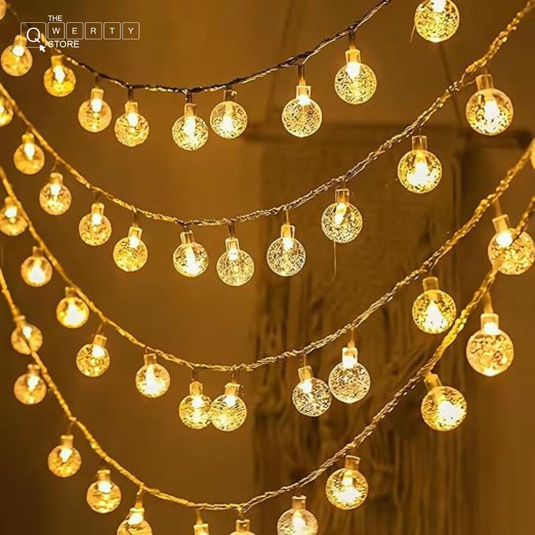 String lights with round bulbs glowing, warm light during the evening